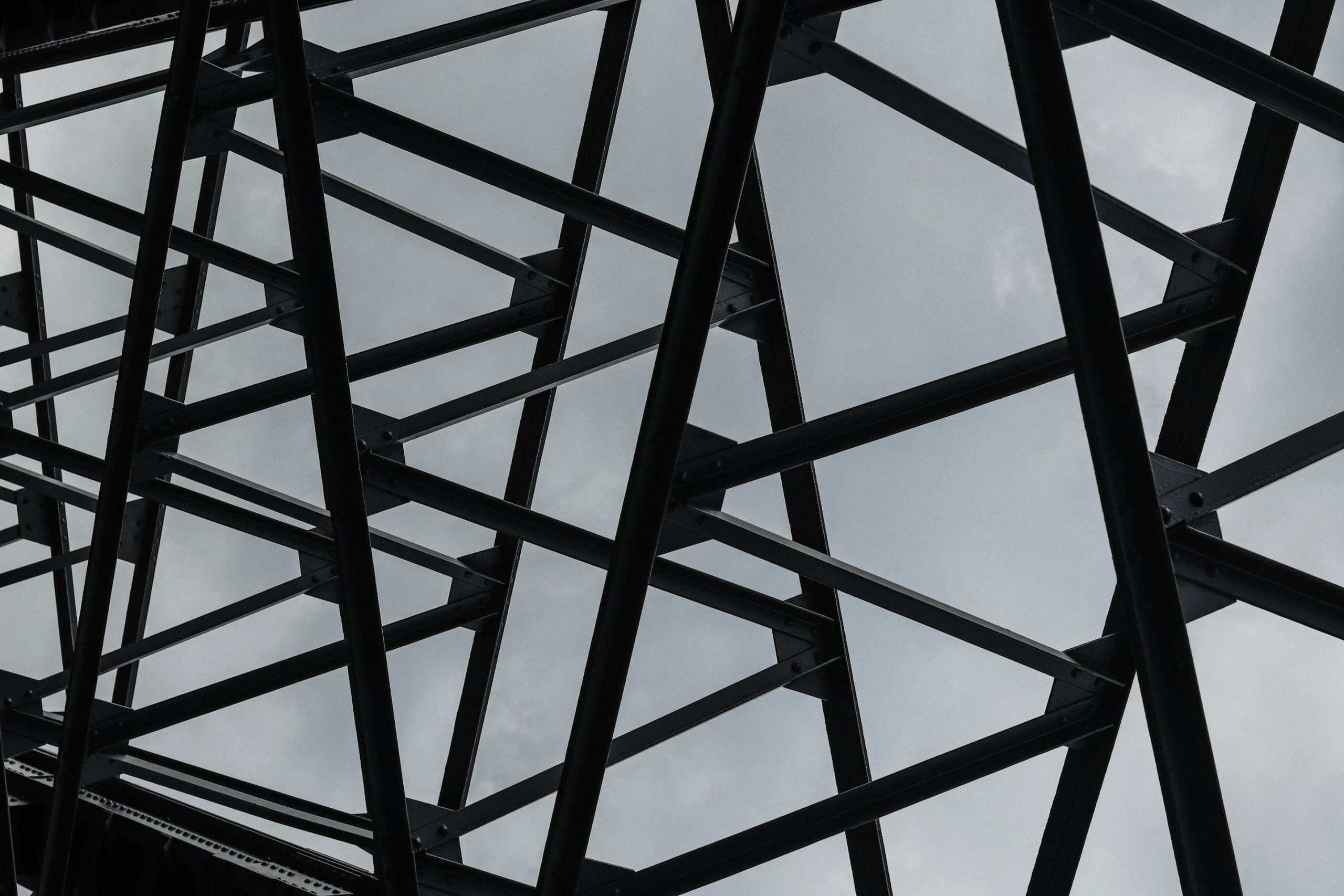 Skills Framework - a view of a framework of interconnected beams and girders with grey sky in the backgroud.